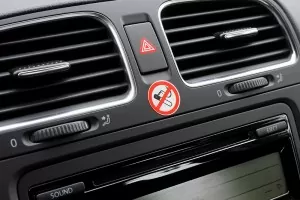 No Smoking sign on car dashboard